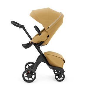 Stokke Xplory X, złoty żółty luksusowy wózek spacerowy regulowany dla wygody dziecka i rodziców wyściółka, szelki odblaskowy zamek błyskawiczny składany w jednym kroku Stokke Xplory X, złoty żółty luksusowy wózek spacerowy regulowany dla wygody dziecka i rodziców wyściółka, szelki odblaskowy zamek błyskawiczny składany w jednym kroku